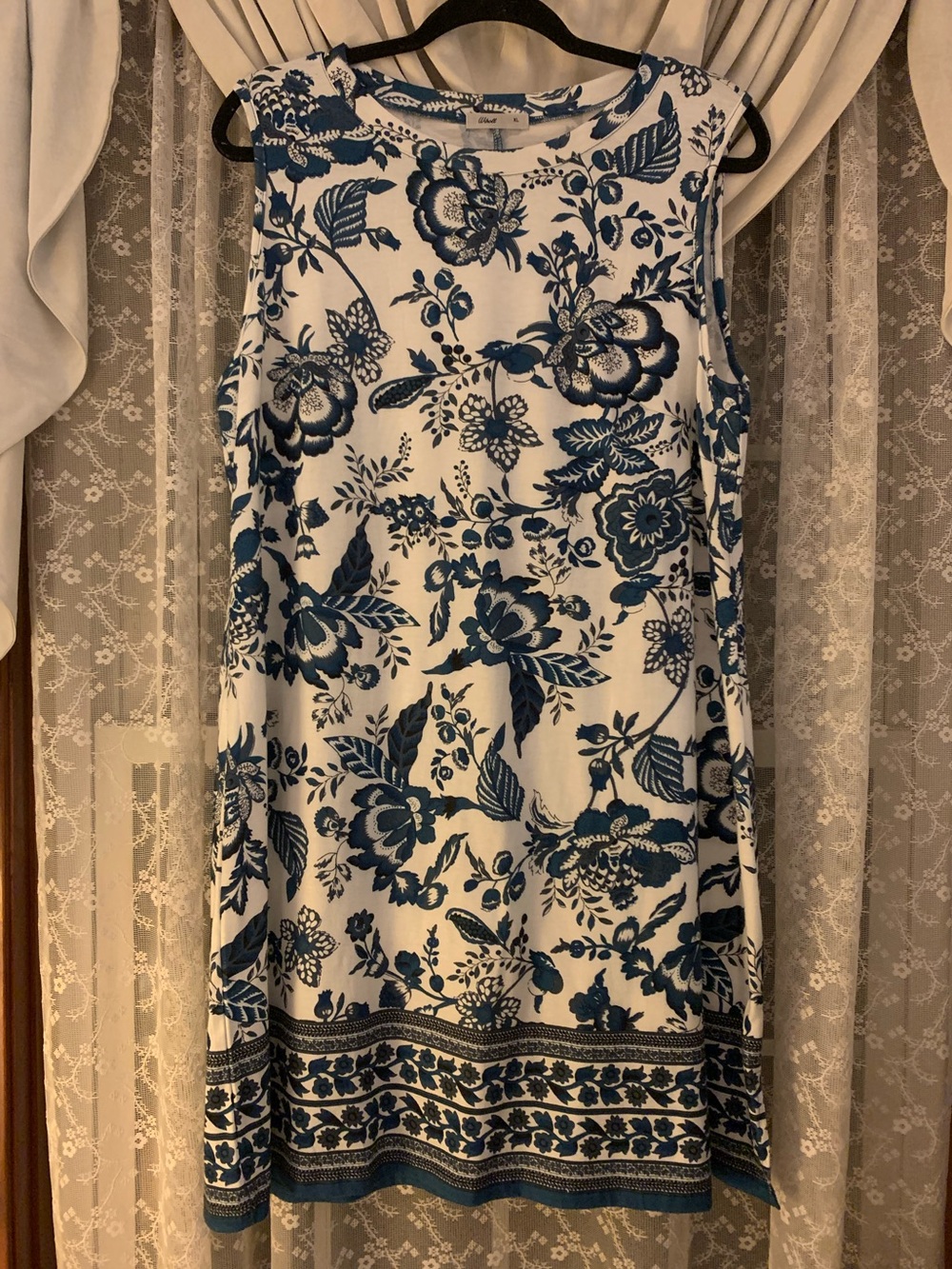 Sleeveless White Mini Dress with Blue Floral Print